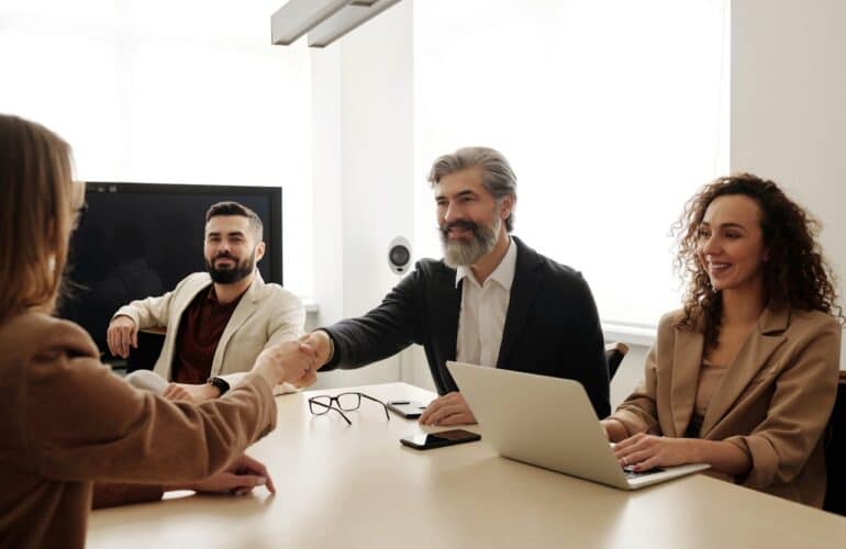 Team celebrating a successful project milestone with augmented staff